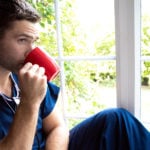 Male Nurse Drinking Coffee on Break