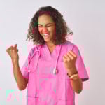 Young nurse wearing pink scrubs with stethoscope