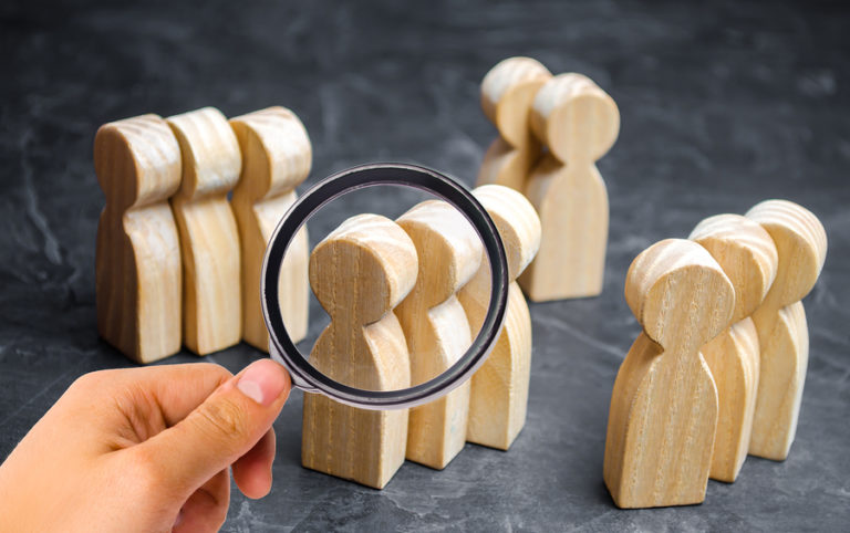 Wooden people figured represent nursing in community care