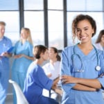 Nurse educator standing in front of class