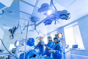 OR nurses helping doctor during surgery