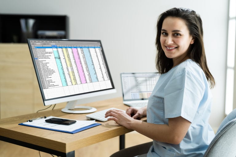 Woman nurse studying at her computer.