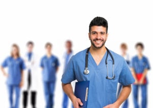 Doctor of Nursing Practice in front of his team of nurses