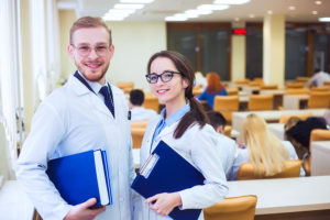 Two nursing students in a classroom earning their doctorate degrees in nursing