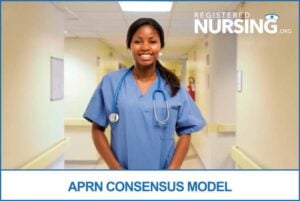 An APRN stands in the hallway of a hospital.