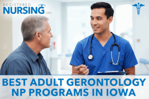 Male AGNP in scrubs holding a clipboard speaking with an older male patient in a clinic setting